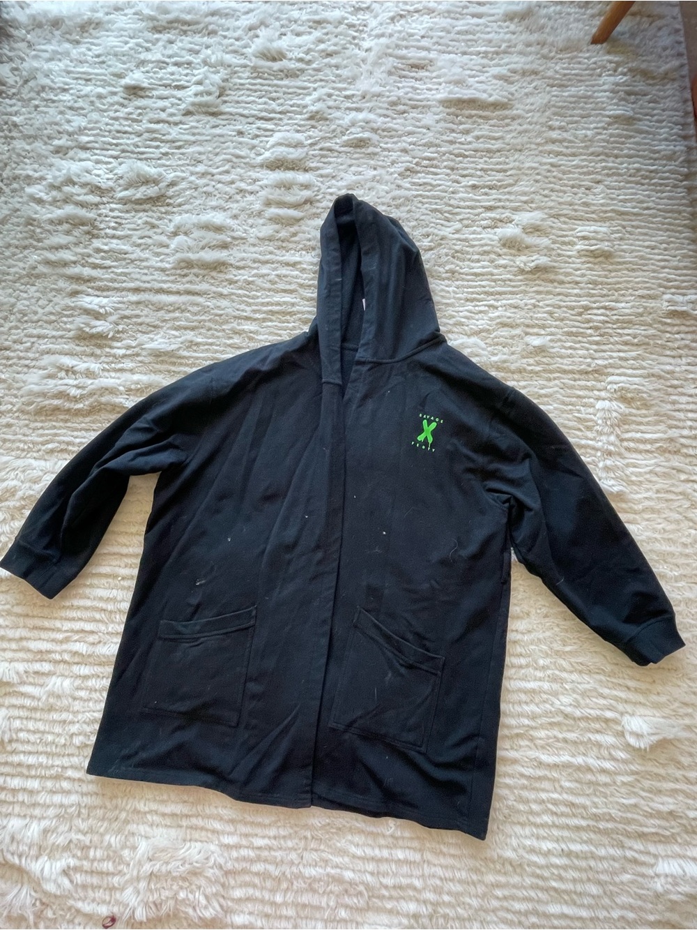 Savage X Fenty Black Hood with Neon Green logo.